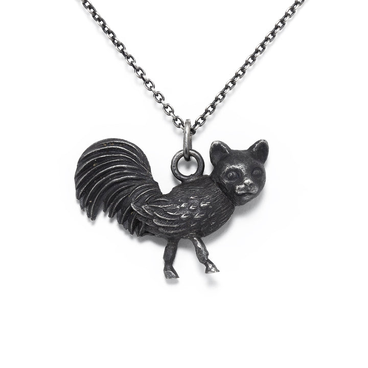 Elen: From the Nous Les Animaux series, this little sterling silver pendant is a nod to the mythical chimaera, with a cat's head on a rooster's body.