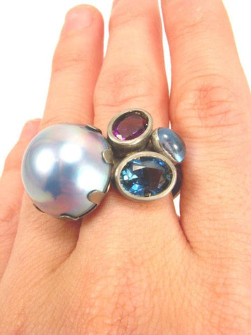 Float Ring.   Black rhodium plated sterling silver, mabe pearl, London blue topaz, Swiss blue topaz, amethyst