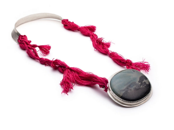 Neckpiece with silk fibers, fine silver, and marble by Gustavo Estrada.
