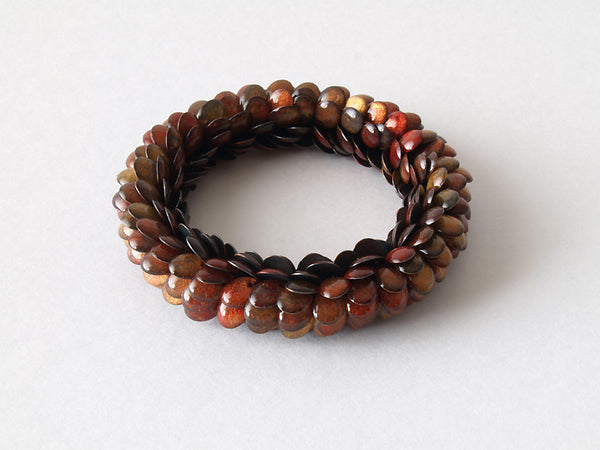 Red and Orange Snake Bracelet with glass beads and thread.