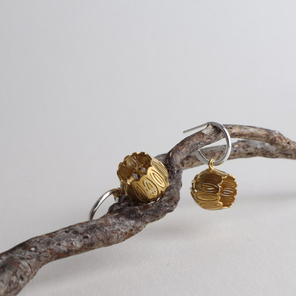 Golden Tulip Hoops  2.5 x 1.5 x 1.5 cm  Sterling silver, 14k gold Vermeil  Techniques: Hand cut silver, gold plating