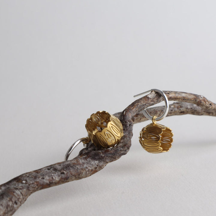 Golden Tulip Hoops  2.5 x 1.5 x 1.5 cm  Sterling silver, 14k gold Vermeil  Techniques: Hand cut silver, gold plating