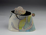 Homey, short vase in cone 6 stoneware, finished with glazes, underglazes and gold luster.  6 x 7 x 4"
