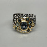 Hand stamped sterling silver ring with a bubble of stunningly coloured Montana sapphires, diamonds, and 18k gold. 