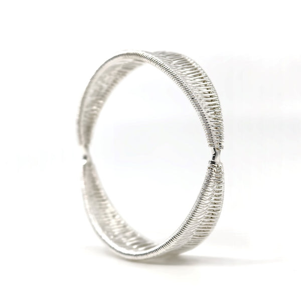 Bilateral no. 3 bangle, hand-woven in sterling silver. 