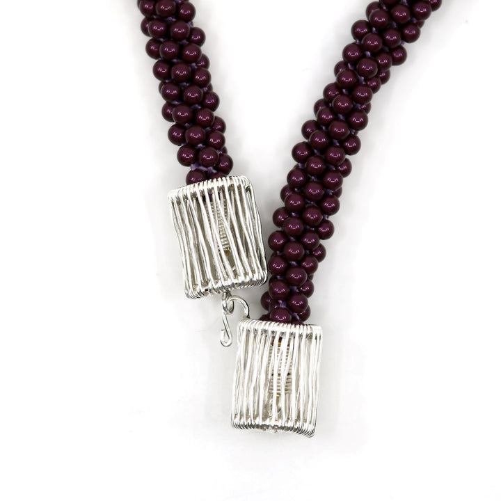 Blackberry Hook: Kumihimo braided and woven necklace of sterling silver, purple Swarovski pearls, & silk ribbon. 