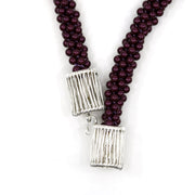 Blackberry Hook: Kumihimo braided and woven necklace of sterling silver, purple Swarovski pearls, & silk ribbon. 