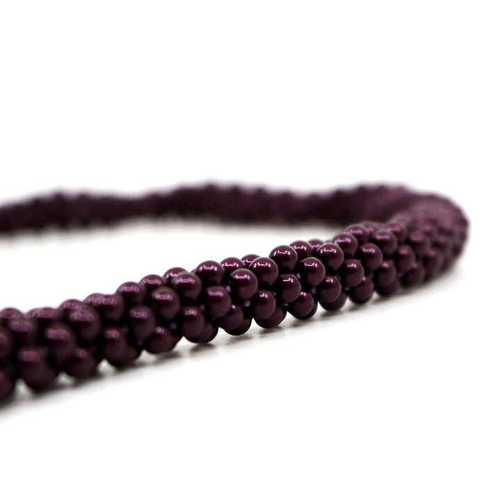 Blackberry Hook: Kumihimo braided and woven necklace of sterling silver, purple Swarovski pearls, & silk ribbon. 