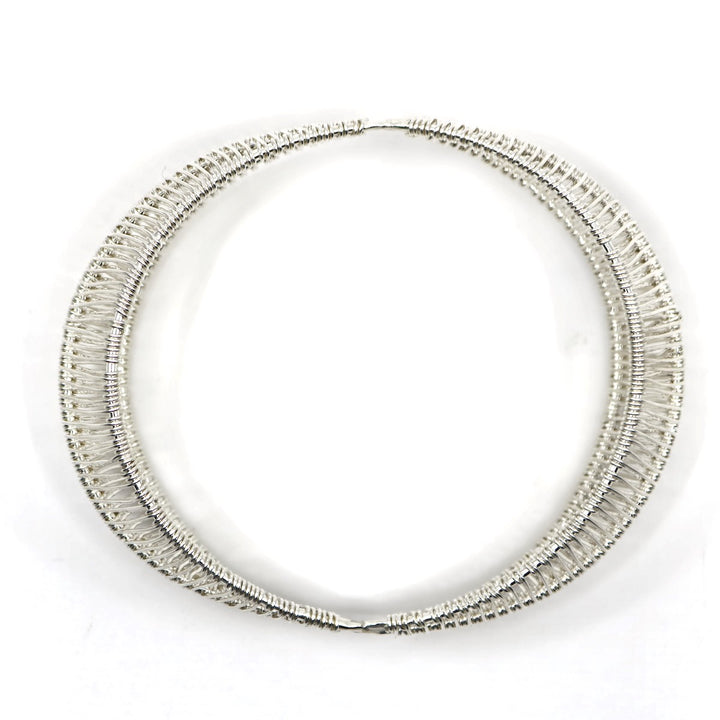 Bilateral no. 2 bangle, hand-woven in sterling silver. 