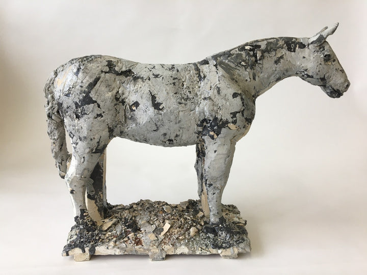 Small Gray Horse 1. Ceramic sculpture of a horse. Its beautiful dappled texture was achieved with layers of coloured engobes and glazes. This sturdy steed measures 40 x 10 x 30 cm.
