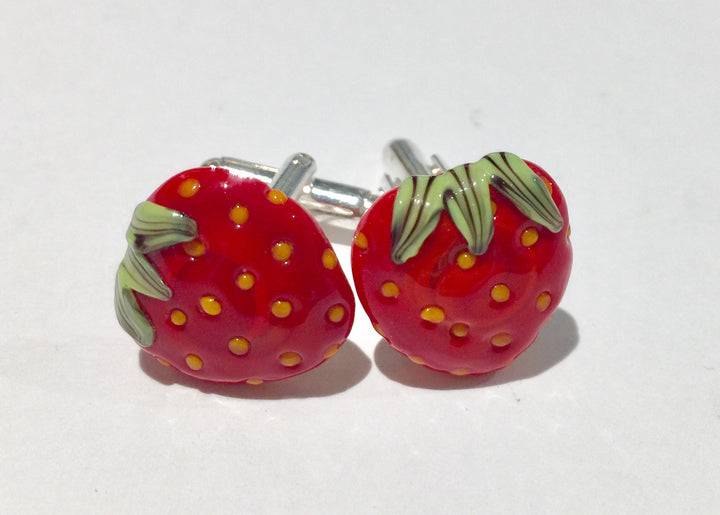Strawberry shaped cufflinks of flame-worked glass.