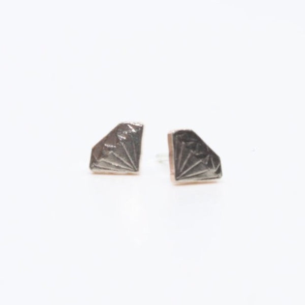 Tiny and precious diamond stud earrings hand sawn from Arkansas coins. Cupronickel clad copper with sterling silver findings.