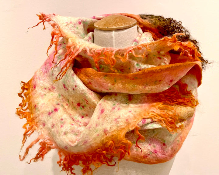 Long orange scarf in hand-dyed silk and merino wool, with recycled materials.