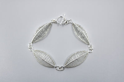 Petal bracelet, hand-woven in sterling silver.   8.5" long