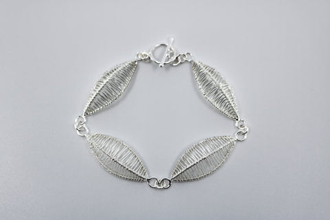 Petal bracelet, hand-woven in sterling silver.   8.5" long
