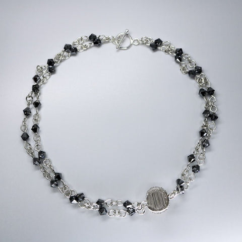The Ol’ Razzle Dazzle necklace, hand-woven in sterling silver and Swarovski 17.5" long