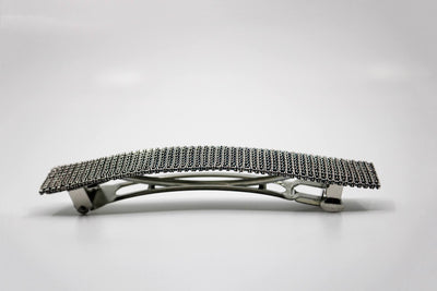 Hand-woven sterling silver barrette.  4” long