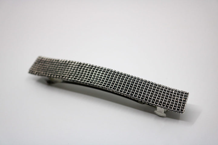 Hand-woven sterling silver barrette.  4” long
