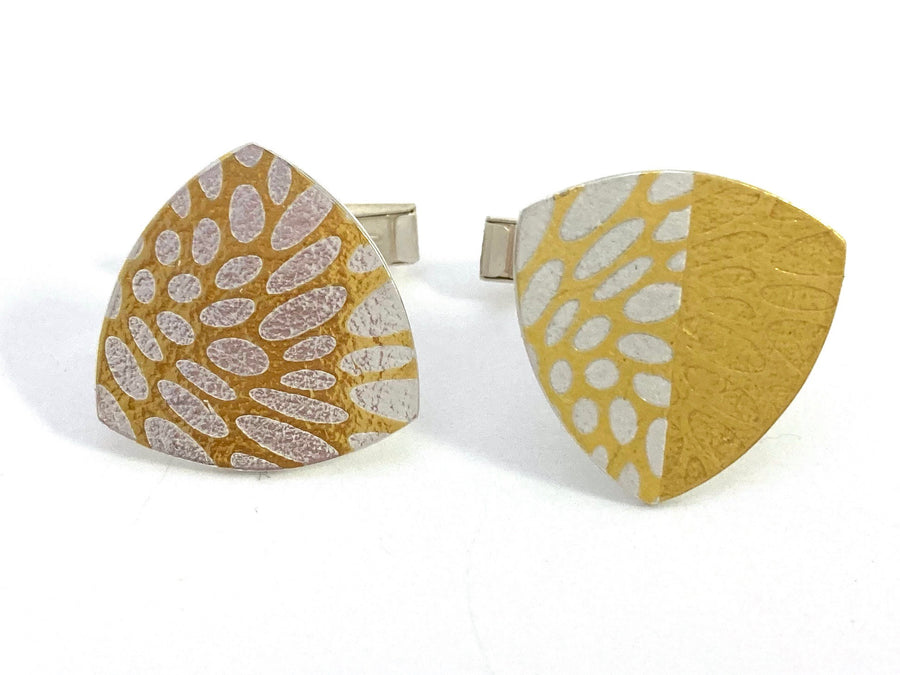 These Trillion keum-boo cufflinks are sterling silver with 24 karat gold that has been diffusion-bonded and formed, resulting in an exciting interplay between two fine metals. Measuring approximately 3cm x 3cm.