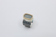 Hand stamped sterling silver ring with a large aquamarine encased in 18K yellow gold and diamonds.   Size 7