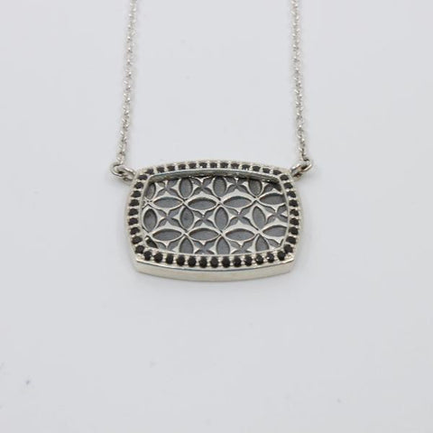 Necklace with black spinels set in sterling silver around a stamped pattern.