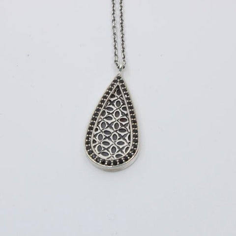 Necklace with black spinels set in sterling silver around a stamped pattern.