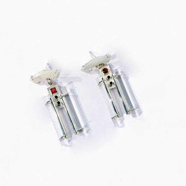 1925 Earrings. ﻿Influenced by the 1920s, these earrings feature mother-of-pearl, garnet and spinels and are hand fabricated in sterling silver and acrylic.