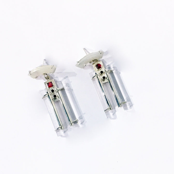 1925 Earrings. ﻿Influenced by the 1920s, these earrings feature mother-of-pearl, garnet and spinels and are hand fabricated in sterling silver and acrylic.