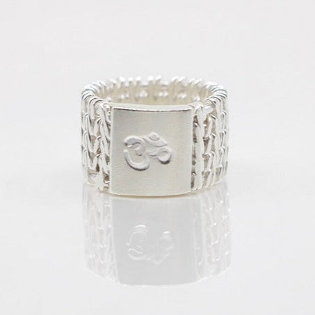 Sterling silver woven ring with an om symbol in a size 6.5
