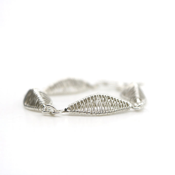 Petal bracelet, hand-woven in sterling silver. 