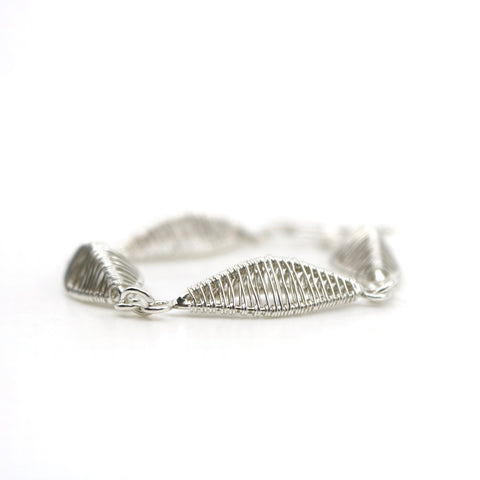 Petal bracelet, hand-woven in sterling silver. 