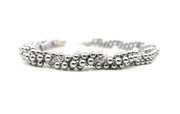 Eternal necklace, 2022. Swarovski pearls and clear crystals are braided into an elegant form using traditional Japanese kumihimo braiding. The clasp is made from woven sterling silver.