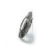 Sample-Collection Drill Hole Brooch in sterling silver, 14K yellow gold and stainless steel.