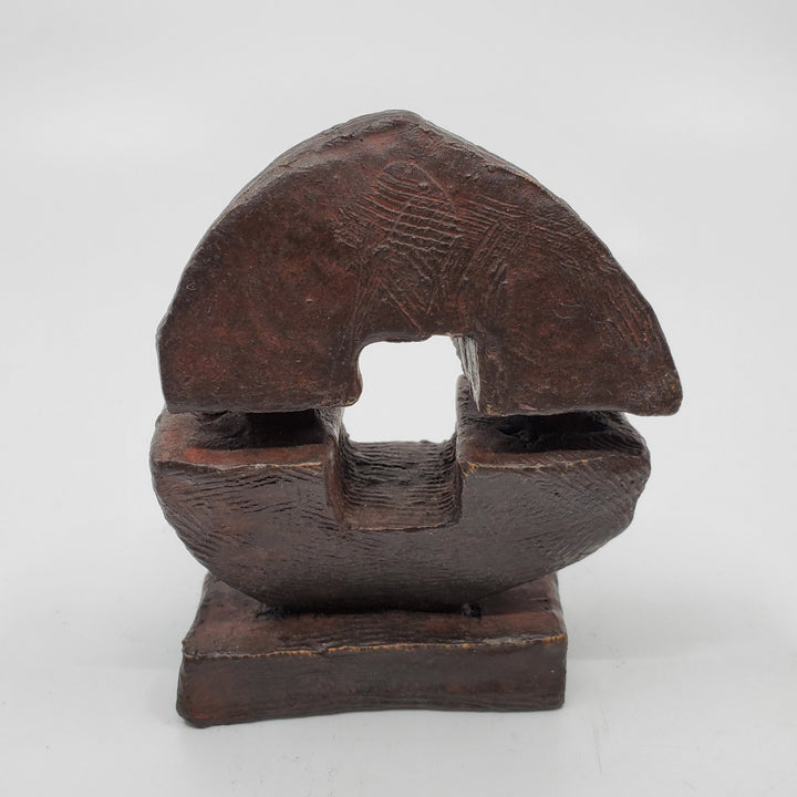 Force sculpture in bronze. The minimalist shape of this piece is complimented by the ornate etching that covers the sculpture.   10 x 8 x 4 cm