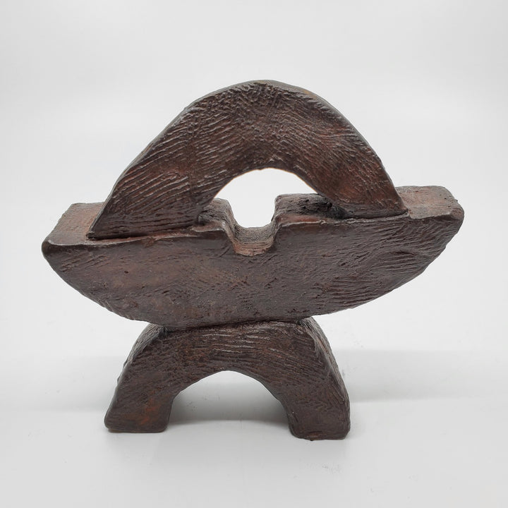 Juste sculpture in bronze. The minimalist shape of this piece is complimented by the ornate etching that covers the sculpture.   10 x 10 x 4 cm