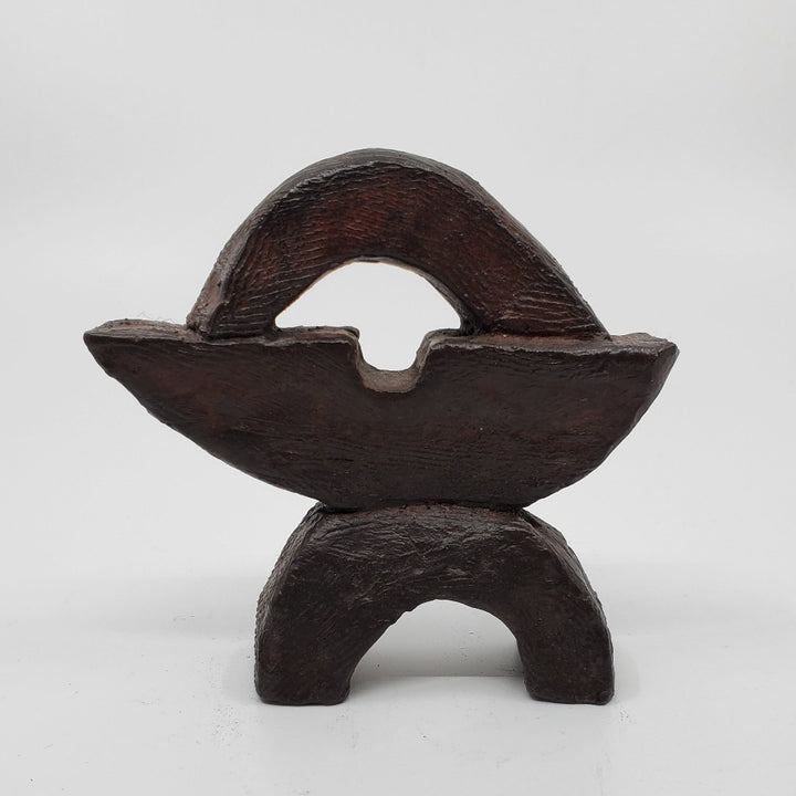 Juste sculpture in bronze. The minimalist shape of this piece is complimented by the ornate etching that covers the sculpture.   10 x 10 x 4 cm