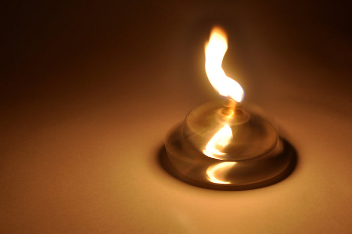 Dancing Lamp formed in Sterling Silver, Brass and Cotton Wick  12 x 12 x 7 cm 