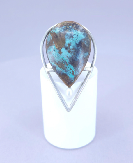 “Leaf Line” Lapel Pin - Sterling silver and copper lapel pin, coloured with a cupric nitrate patina and dotted with a freshwater pearl.