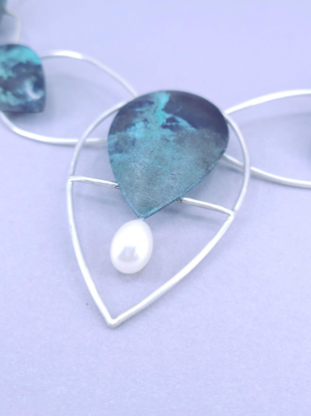 “Leaf Line” Necklace - Copper and sterling silver necklace dotted with a freshwater pearl, and coloured with a cupric nitrate patina.