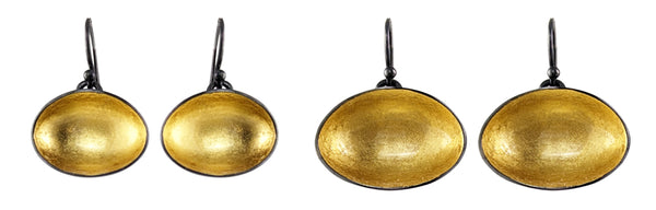 Light drop earrings in horizontal. These concave forms are made from patinated sterling silver with 22k gold leaf and resin. Available in two different sizes.