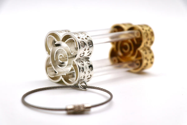 Hourglass-Shaped Belt Accessory - Cast silver and bronze inspired by a marble maze game, with stainless steel chain and plastic tubes.