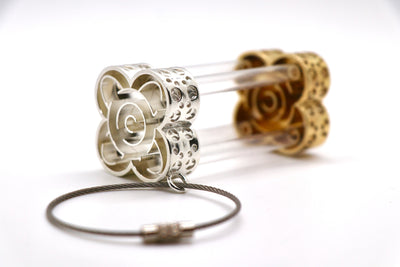 Hourglass-Shaped Belt Accessory - Cast silver and bronze inspired by a marble maze game, with stainless steel chain and plastic tubes.