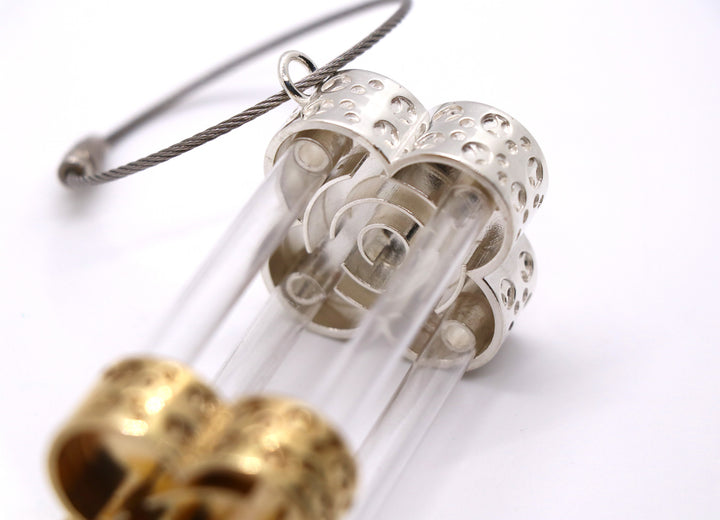 Hourglass-Shaped Belt Accessory - Cast silver and bronze inspired by a marble maze game, with stainless steel chain and plastic tubes.