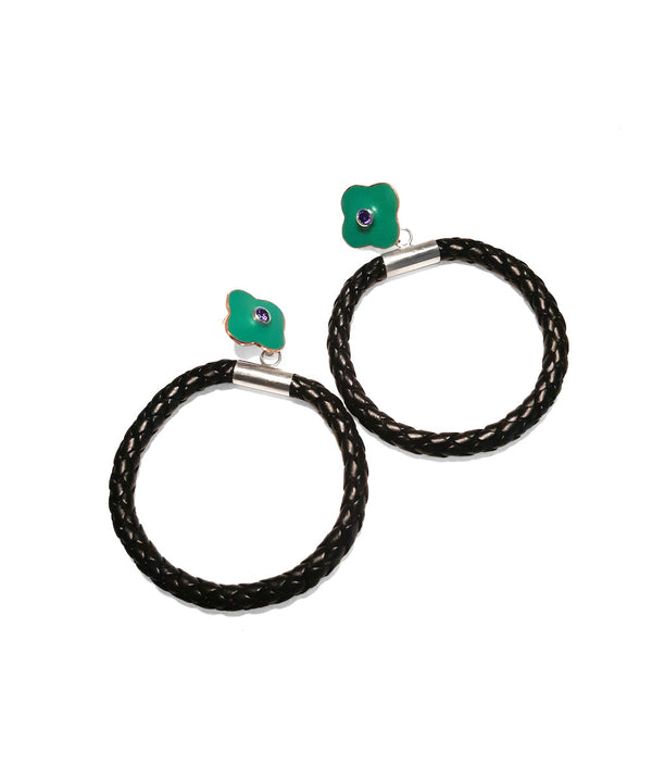 Small flower hoop dangle earrings. Bold earrings featuring a braided faux leather hoop capped with sterling silver that dangles from a turquoise green flower stud. The resin-decorated copper studs are centered with purple cubic zirconia stones, and have sterling silver posts.
