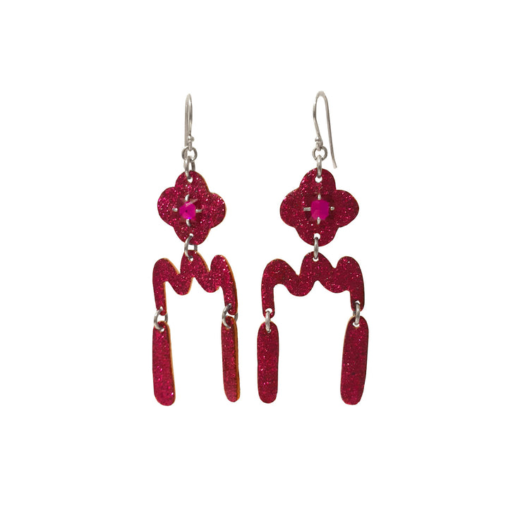 Fuschia Flower Dangle with Ruby. Red rubies gleam from the center of each flower. The glitter resin-decorated copper segments are suspended from sterling silver shepherd hooks.