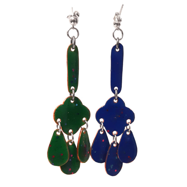 Lucky Clover Dangle Earrings. The playful glitter resin-decorated copper stud earrings are fully enamelled on both sides: green when seen from the front, and blue when seen from the back. They have sterling silver posts.