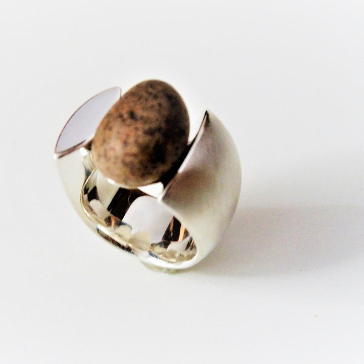 Pebble stone ring in a wide rounded sterling silver band. Size 7; 2 x 2 cm.