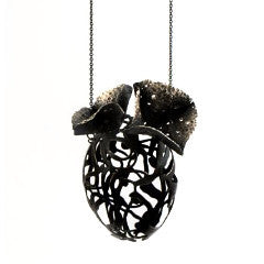  Efflorescent pendant in sterling silver with patina.