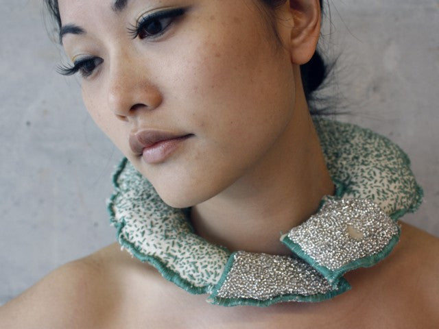 Fields neck piece in canvas, beading and leather by contemporary Canadian jewellery artist Rebecca Horwitz.