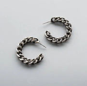 Matte oxidized stud earrings are transformed salvaged chains hand-fabricated into hoops. 